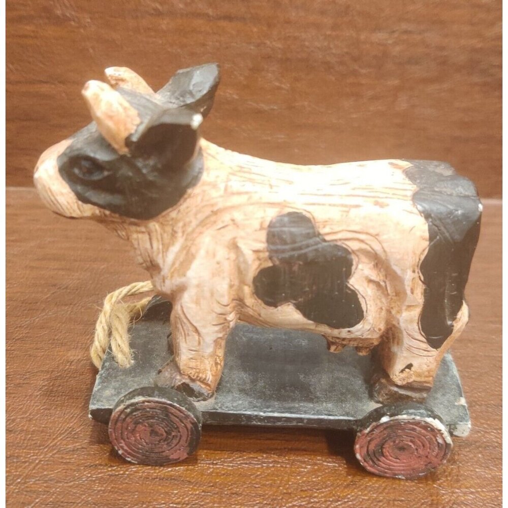 Rustic Plastic Wood-like Carved Black Spotted Cow on Pull Cart Farm Barn Decor